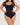 Woman wearing the BZEZ Smoothing Sculpt Bodysuit Thong in Onyx (black), front view