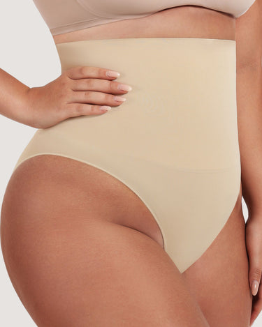 Woman wearing the BZEZ Mid Fit Control Brief in Bare, back view