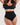 Woman wearing the BZEZ Mid Fit Control Thong in Onyx (black), front view