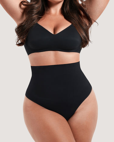Woman wearing the BZEZ Mid Fit Control Thong in Onyx (black), front view