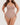 Woman wearing the BZEZ Smoothing Sculpt Bodysuit Thong in Bare, front view