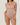 Woman wearing the BZEZ Smoothing Sculpt Bodysuit Brief in Bare, front view