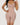 Woman wearing the BZEZ Smoothing Sculpt Bodysuit Shorts in Bare, front view