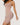 Woman wearing the BZEZ Smoothing Sculpt Bodysuit Shorts in Bare, side view