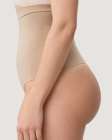 Woman wearing the BZEZ Smoothing Sculpt High-Waisted Thong in Bare, side view