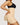 Woman wearing BZEZ Uplift Booty Shorts in Bare, side view